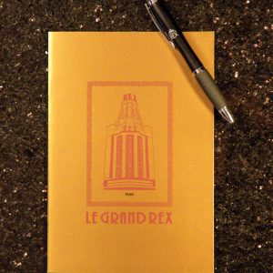 Carnet à l'effigie du grand rex, cinéma à paris, de couleur or